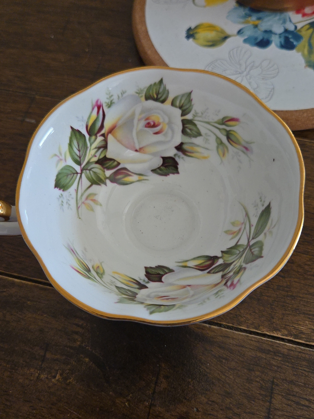 White Floral Porcelain Teacup with Gold Rim